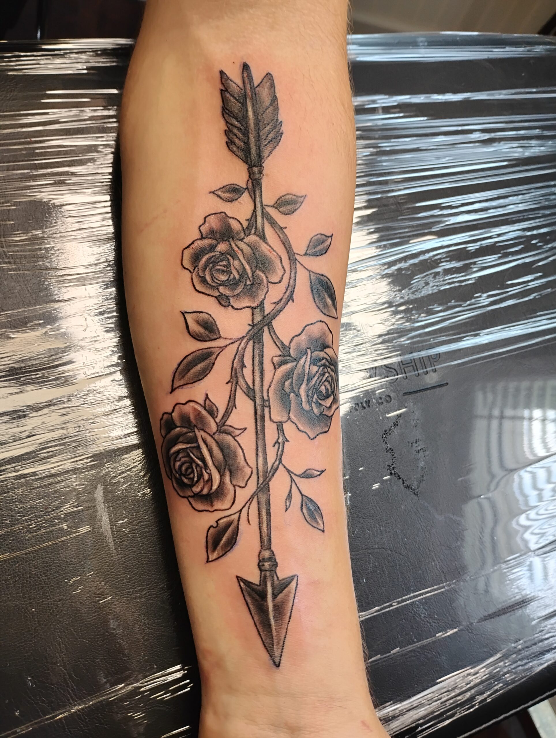 Almont Ink - Ethan's 18th Birthday Tattoo - Arrow with Flowers - Timm Nowakowski